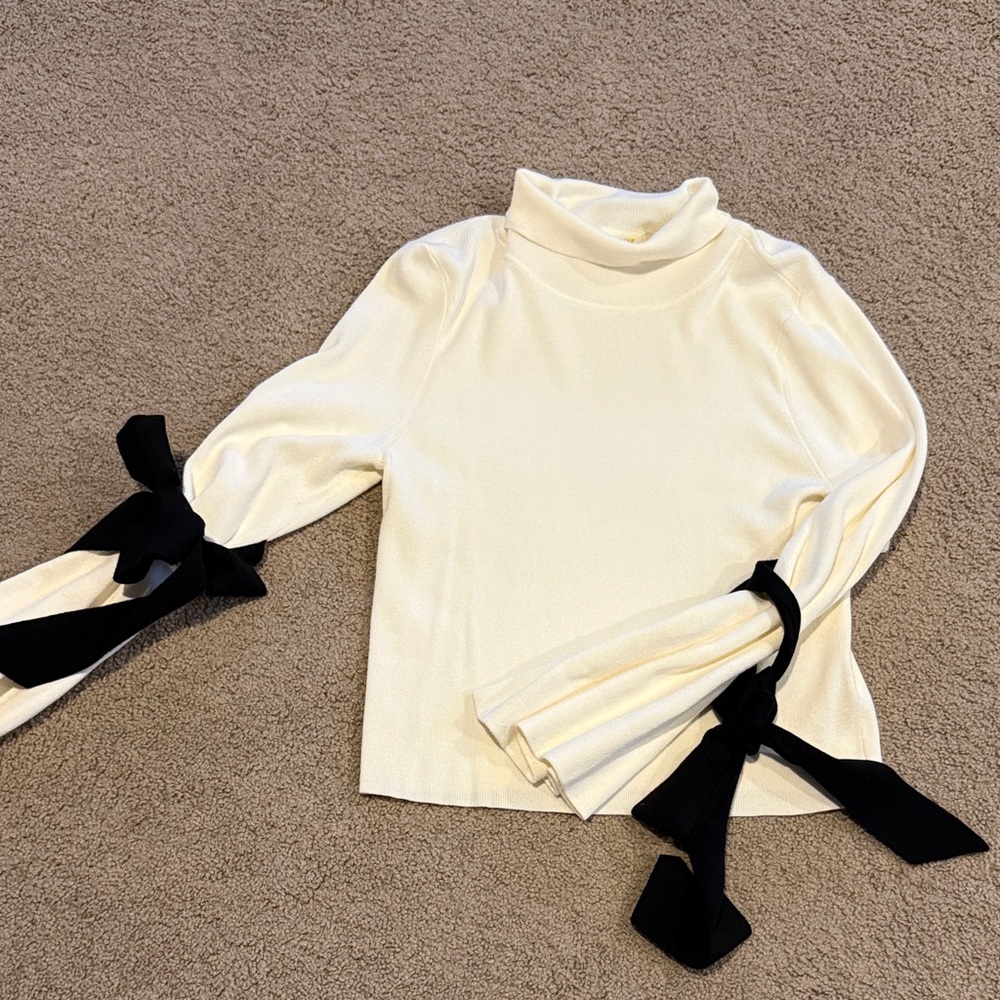 Maeve Anthropologie Cream Knit Turtleneck with bow sleeve detail